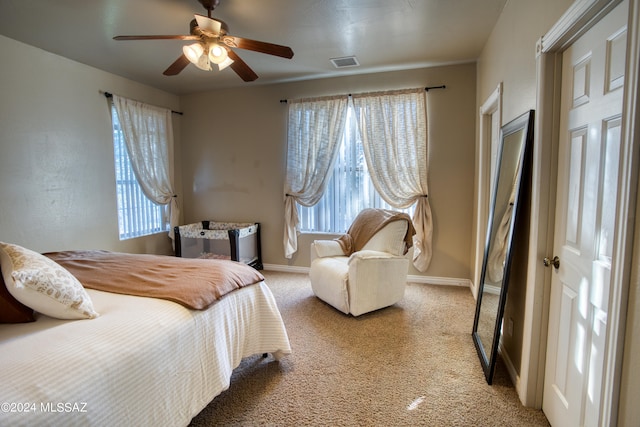 carpeted bedroom featuring ceiling fan