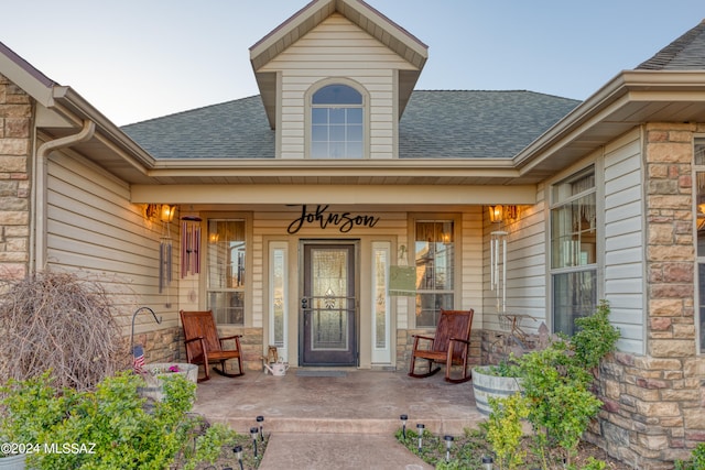 entrance to property with covered porch