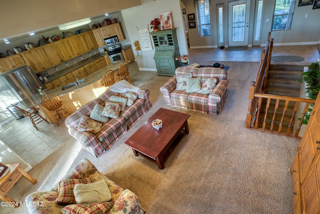 living room with tile flooring and sink