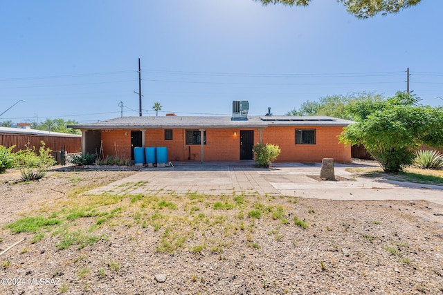 rear view of house with a patio