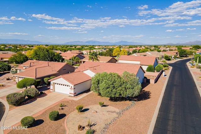 drone / aerial view with a residential view and a mountain view