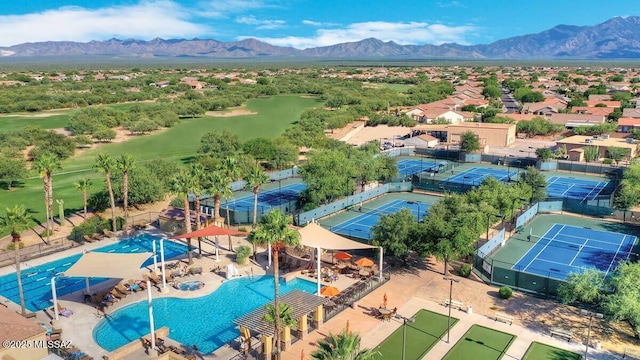 birds eye view of property with a mountain view