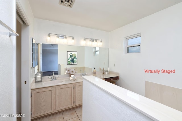 bathroom with tile patterned flooring and vanity