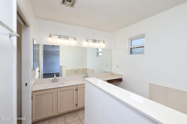 bathroom with tile patterned floors and sink