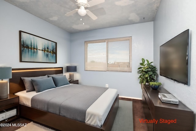 bedroom featuring hardwood / wood-style floors and ceiling fan