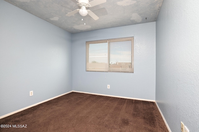 spare room with carpet flooring, ceiling fan, and a textured ceiling