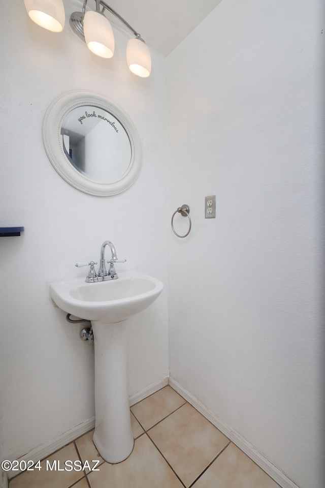 bathroom featuring tile patterned flooring and sink