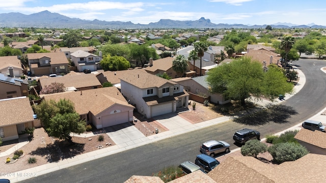 birds eye view of property featuring a mountain view