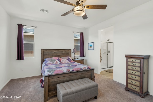 carpeted bedroom with multiple windows and ceiling fan