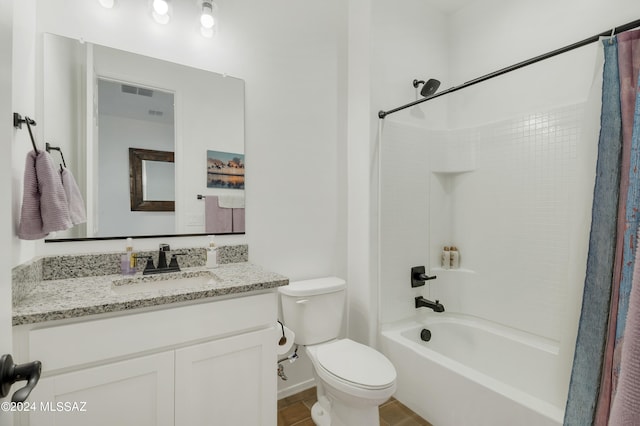 full bathroom featuring tile patterned floors, vanity, shower / tub combo with curtain, and toilet