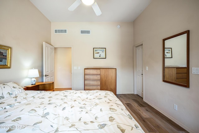 bedroom featuring hardwood / wood-style floors, a closet, and ceiling fan