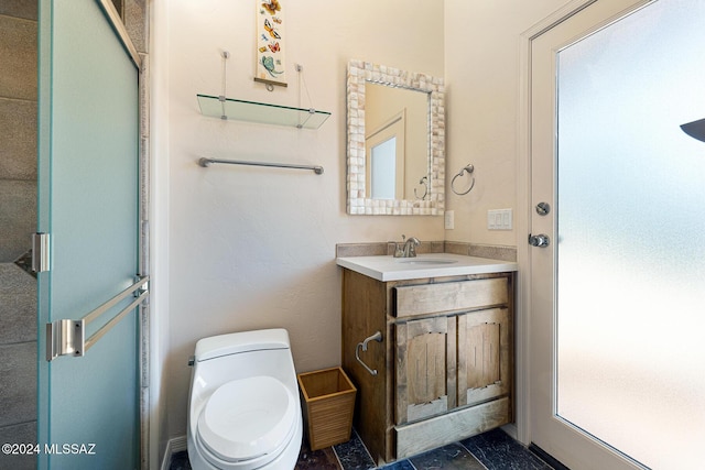 bathroom with vanity and toilet