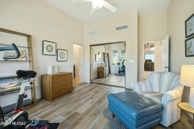 sitting room featuring ceiling fan and light hardwood / wood-style flooring