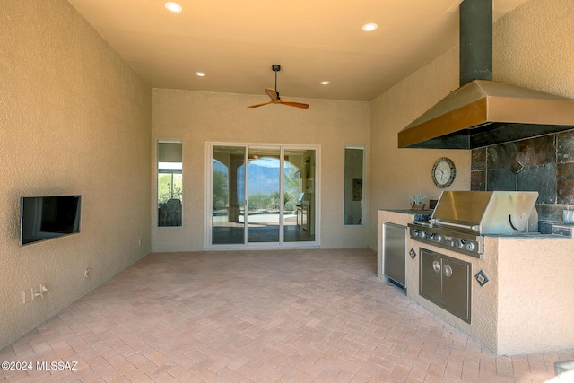 view of patio with area for grilling, grilling area, and ceiling fan