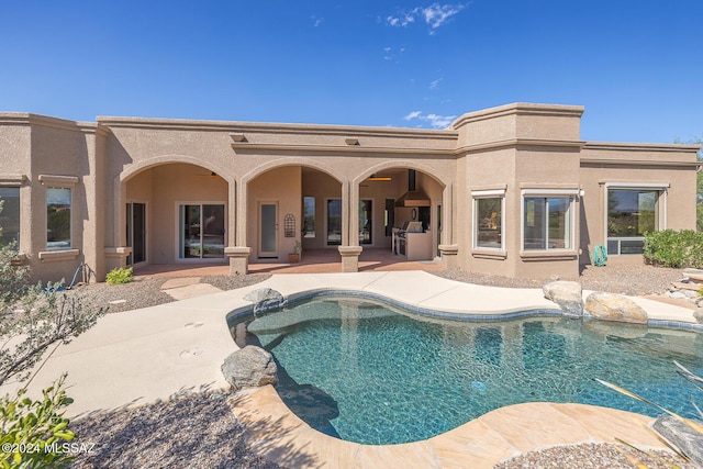 view of swimming pool with a patio area