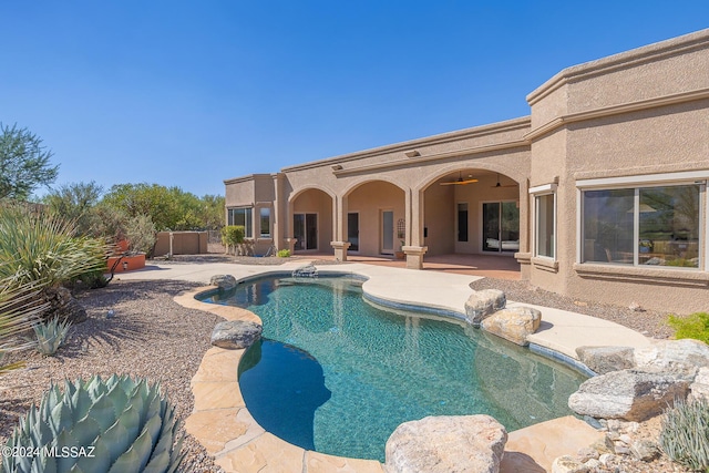 view of swimming pool with a patio area