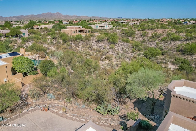 birds eye view of property with a mountain view