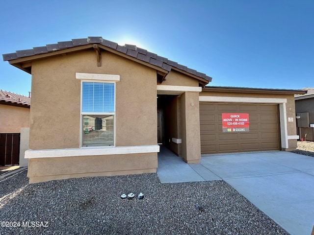 view of front of home with a garage