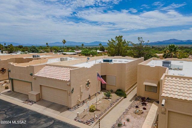 birds eye view of property with a mountain view