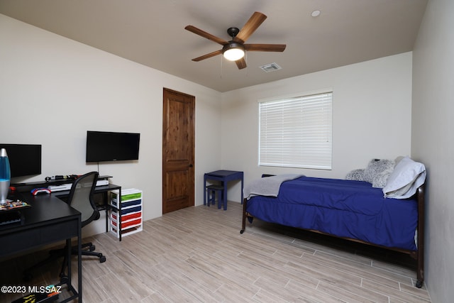 bedroom featuring ceiling fan and light hardwood / wood-style flooring