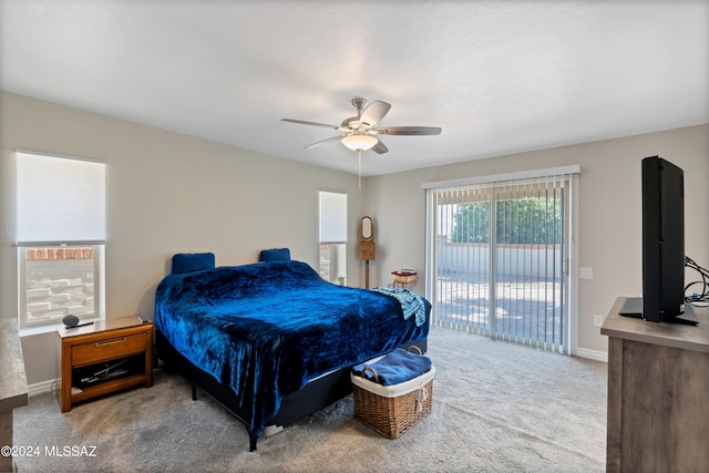 carpeted bedroom featuring access to outside and ceiling fan