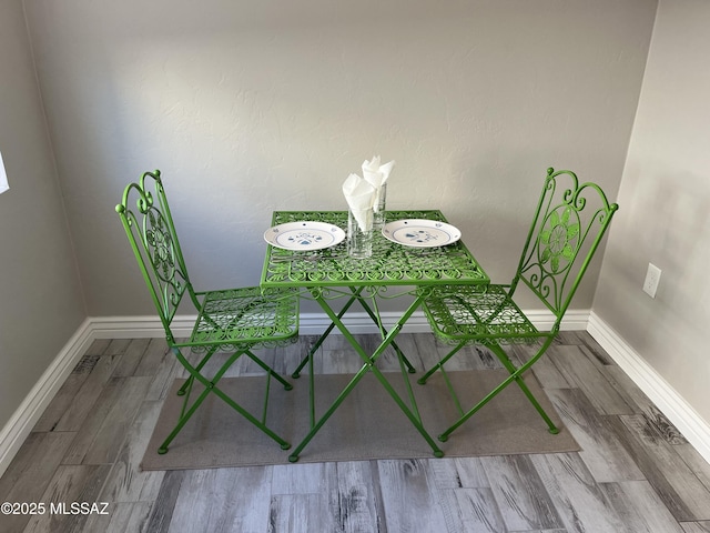 dining area featuring hardwood / wood-style floors