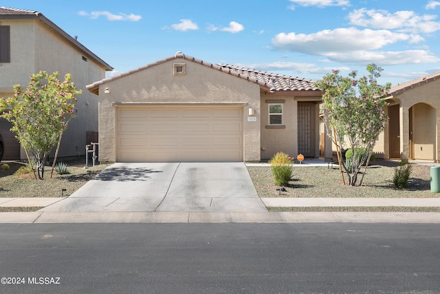 view of front of property featuring a garage