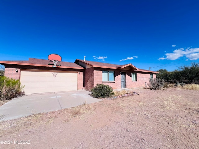 ranch-style house featuring a garage