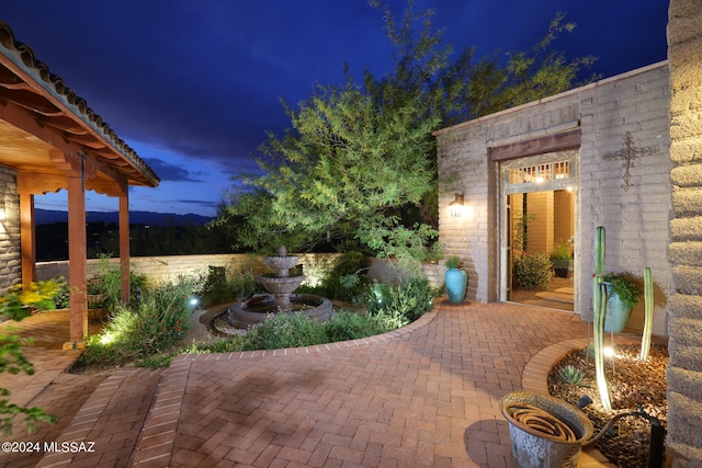 view of patio at night