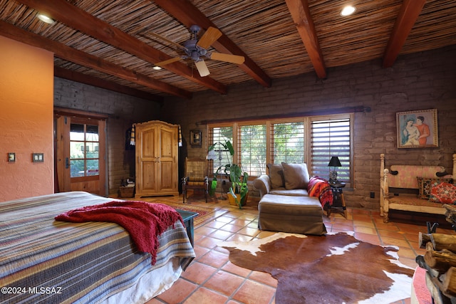 bedroom with beam ceiling, light tile patterned flooring, and wooden ceiling