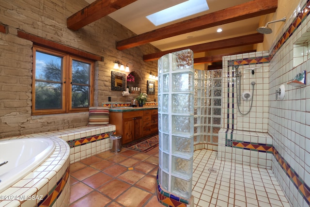 bathroom with a bath, a skylight, walk in shower, vanity, and beamed ceiling