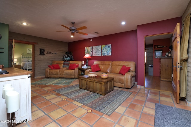 living area featuring a ceiling fan, recessed lighting, light tile patterned flooring, and visible vents