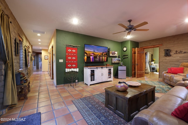 living area with a ceiling fan, baseboards, recessed lighting, light tile patterned floors, and visible vents