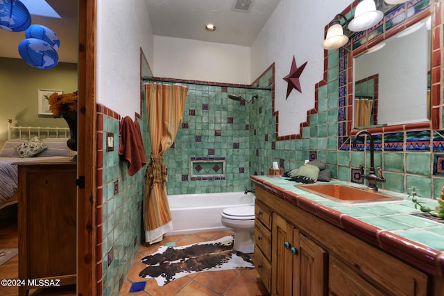 full bathroom featuring visible vents, shower / bath combination with curtain, tile patterned floors, vanity, and toilet