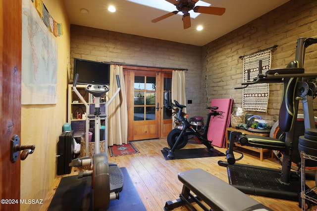 exercise room featuring a ceiling fan, recessed lighting, and hardwood / wood-style floors
