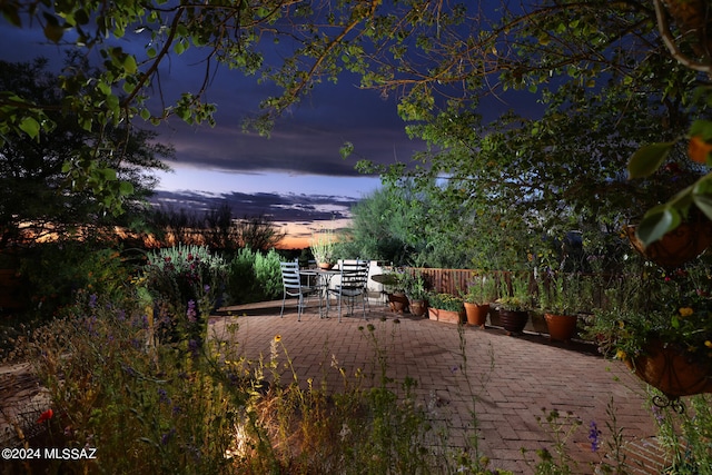 view of patio terrace at dusk