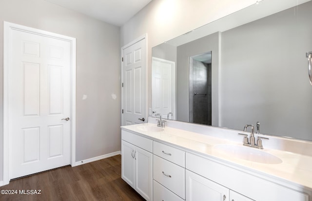 bathroom with vanity and hardwood / wood-style flooring