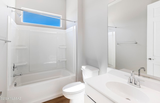 full bathroom featuring vanity, toilet, hardwood / wood-style floors, and shower / bath combination