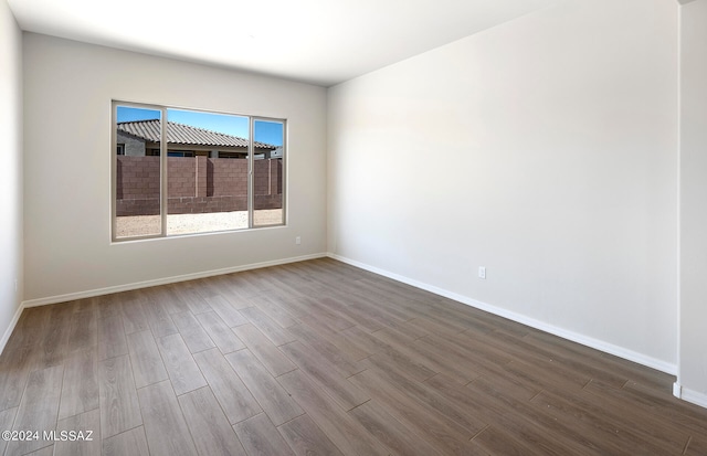 empty room featuring hardwood / wood-style flooring