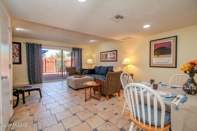 living room with a textured ceiling