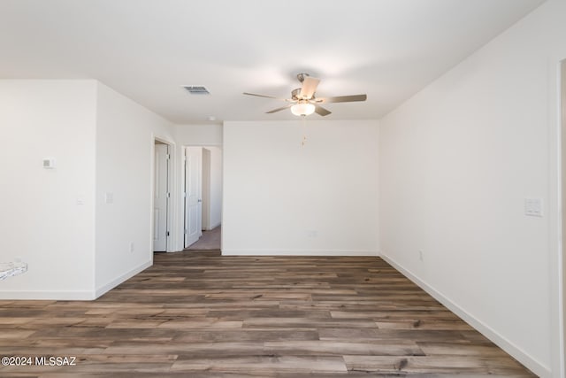 empty room with hardwood / wood-style floors and ceiling fan