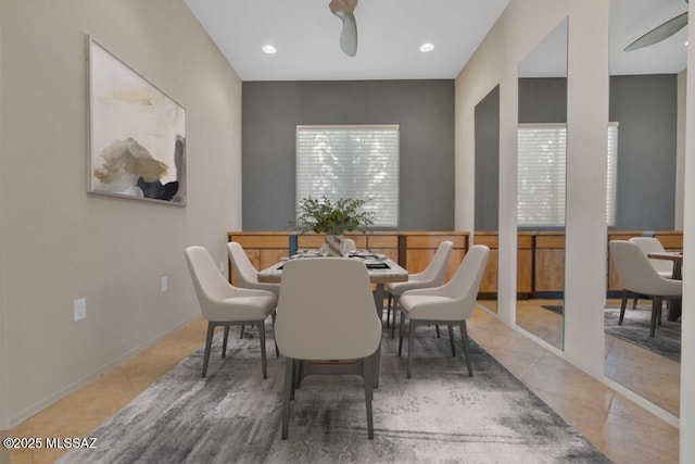 dining area featuring ceiling fan and tile patterned floors