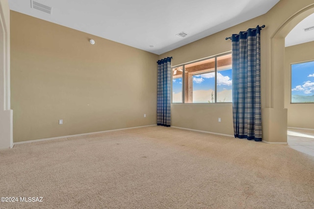 empty room featuring light colored carpet