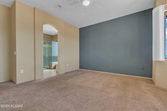 carpeted empty room with ceiling fan