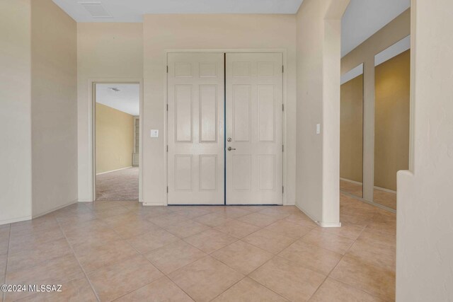 foyer featuring light tile patterned flooring