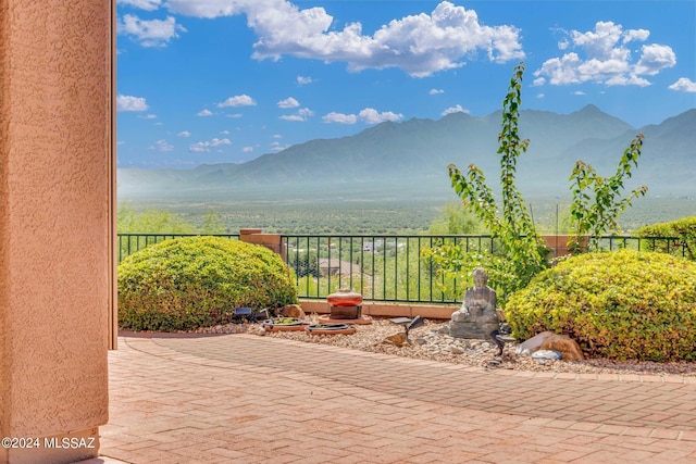 view of patio / terrace with a mountain view