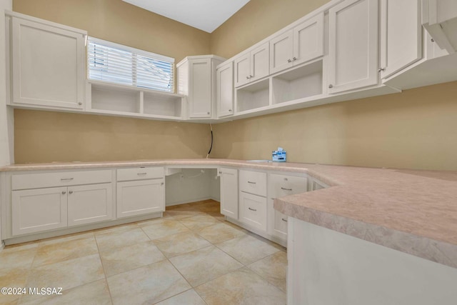 interior space with light tile patterned floors