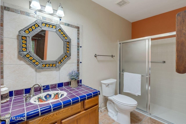 bathroom featuring toilet, a stall shower, tile patterned flooring, and visible vents