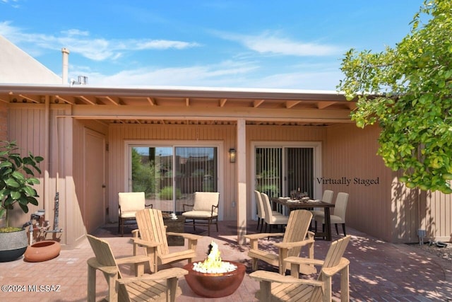 view of patio / terrace featuring a fire pit