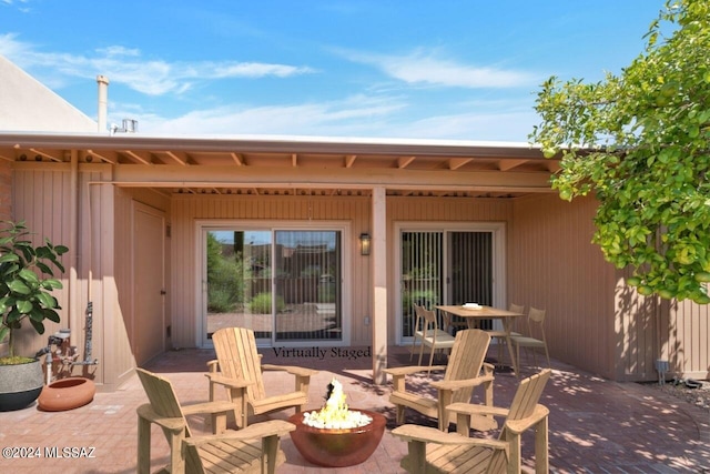 view of patio with a fire pit